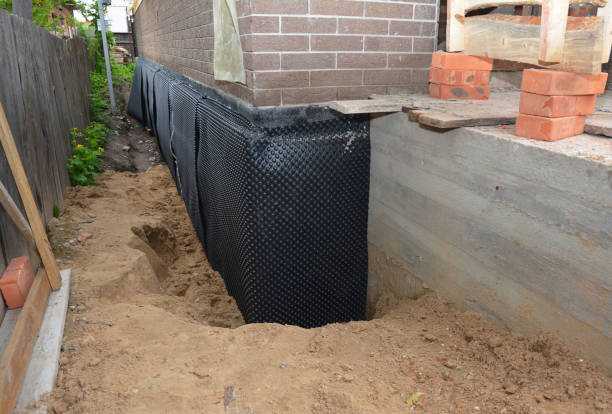 Happy homeowners after waterproofing job in Kyles Ford
